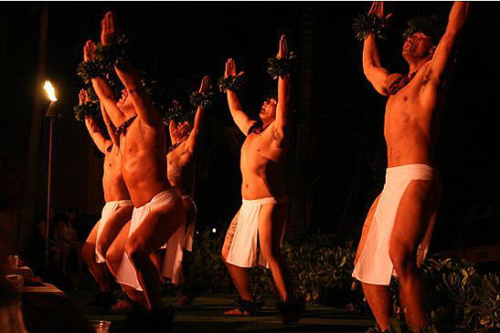 Hawaiian male dancers at a luau show at Kona Village Resort
