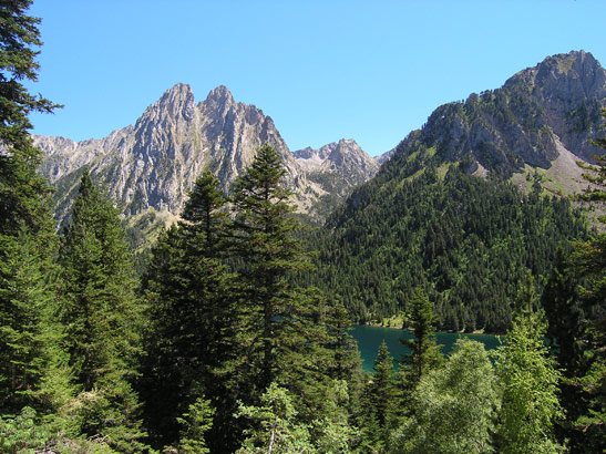 Pyrenees mountains tower over the San Mauricio Lake in the Aigestortes i Estany de Sant Maurici National Park, Catalonia, Spain