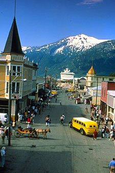 view along Broadway Street in Skagway with the mountains of the Alaskan Range in the background