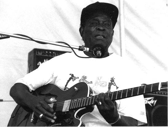 Honeyboy Edwards performing on stage at Long Beach, CA