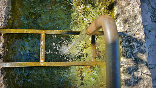 rustic fountain with spring water