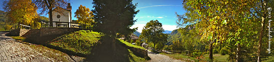 panoramic shot of The Sanctuary of Our Lady of Carravaggio and roughly paved road