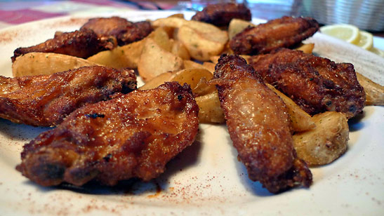 plate of chicken wings served at the Baita-Hutte Raut on the Pista Raut, Monte Elmo, Italy