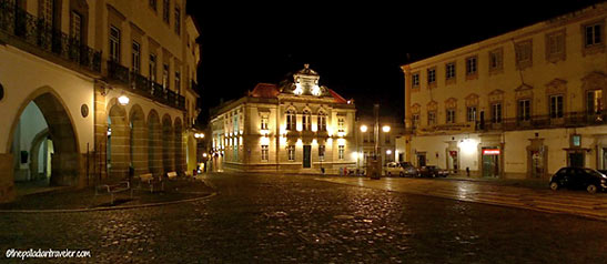 lamp-lit cobble of Rua Cândido dos Reis