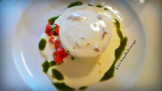 a zucchini and herbs flan underneath a pecorino cheese fondue at teh Osteria di Fonterutoli