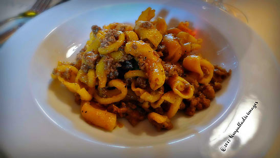 fresh, eggs-and-flour, macaroni pasta in wild boar's sauce