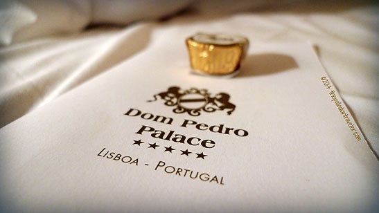Dom Pedro Palace logo and gold-wrapped chocolate