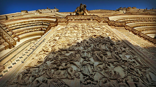 intricate bas-reliefs of biblical stories at the The Cathedral of Our Lady of the Assumption