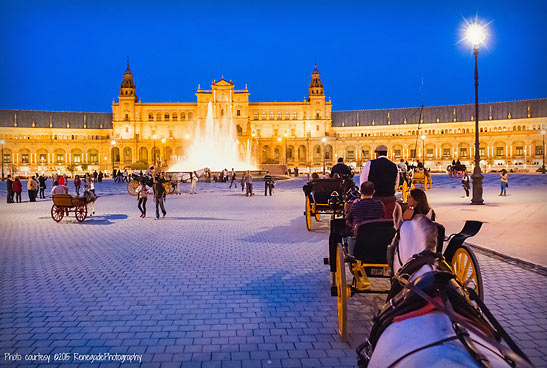 horse-drawn carriage driving around the Plaza Espaa, Seville