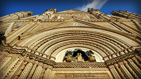 front facade of the The Cathedral of Our Lady of the Assumption, Orvieto viewed from street level