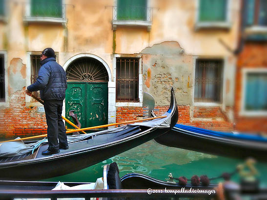 gondolier manuevering a boat