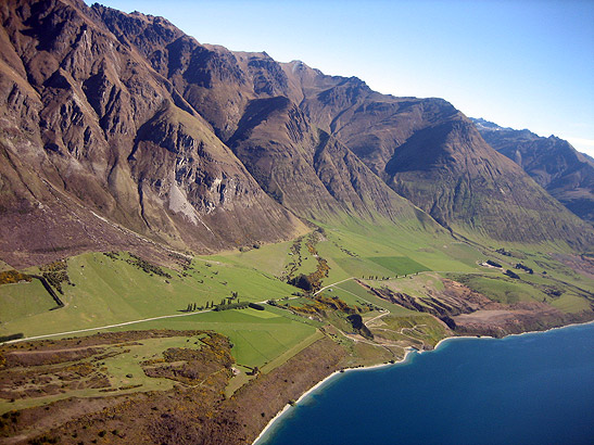 aerial view of South Island coast with hills in the background