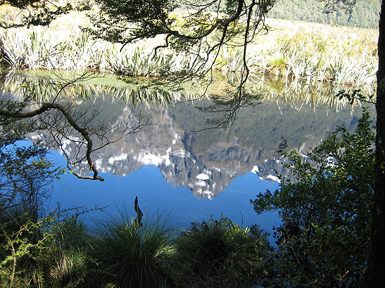 reflection of mountains on Mirror Lakes on the way to Milford Sound