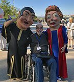 the writer with paper mache puppets in Spain